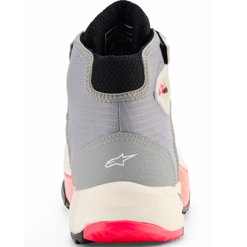 Alpinestars Stella CR-X Drystar motorlaarzen voor dames in de kleuren wit, lichtgrijs, zwart en fluorescerend roze.